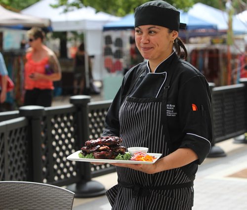 Apprentice Chef - Claire Snowball serves BBQ Ribs on the newly opened patio at Red River's culinary arts institute. 49.8  July 17, , 2013 Ruth  Bonneville , Winnipeg Free Press