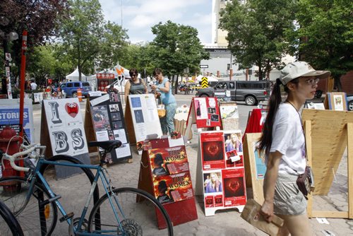 Fringe Festival playbills and posters adorn the streets surrounding Old Market Square in Winnipeg on Thursday, July 18, 2013. (JESSICA BURTNICK/WINNIPEG FREE PRESS)