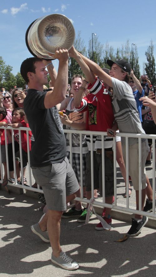 Chicago Blackhawks captain Jonathan Toews arrivies with the Stanley Cup for the hundreds of fans that attended the event at the Jonathan Toews Community Centre Friday afternoon. Randy Turner story Wayne Glowacki/Winnipeg Free Press July 19 2013