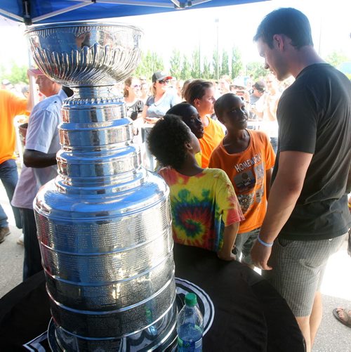 Jonathan Toews  brought the Staley Cup to Dakota Community Centre and spent hours posing for photos and meeting his local fans   Standup photo- July 19, 2013   (JOE BRYKSA / WINNIPEG FREE PRESS)