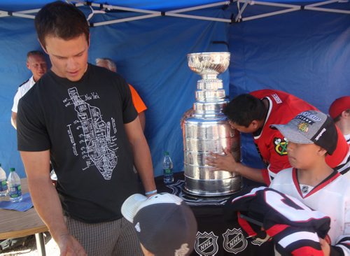 Chris Guimond Sagkeeng First Nation kisses the Staley Cup at Dakota Community Centre after taking photo with Jonathan Toews   Standup photo- July 19, 2013   (JOE BRYKSA / WINNIPEG FREE PRESS)