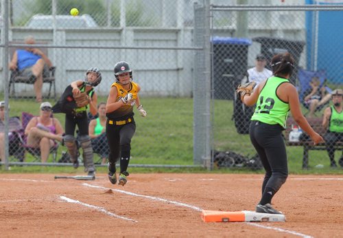 Brandon Sun Westman Magic's Brooke Roeges races to beat the throw out at first base during Friday's fastball tournament game against the Wild. (Bruce Bumstead/Brandon Sun)