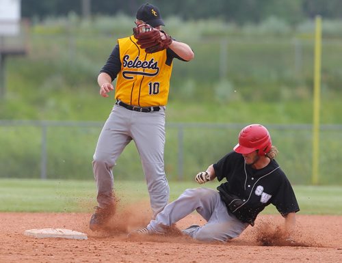 Brandon Sun South West's Cole Olson slides into second base beating the pick-off attempt by the Santa Clara Selects during the opening game of the Senior AA Baseball championships at Brandon Field. (Bruce Bumstead/Brandon Sun)