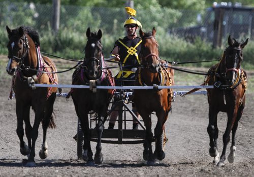 A chariot racer from Gunton, Man. in full charioteer garb returns from the Suicide Ben Hur event. The Manitoba Stampede and Exhibition celebrates its 50th year this weekend. Friday, July 19, 2013. (JESSICA BURTNICK/WINNIPEG FREE PRESS)