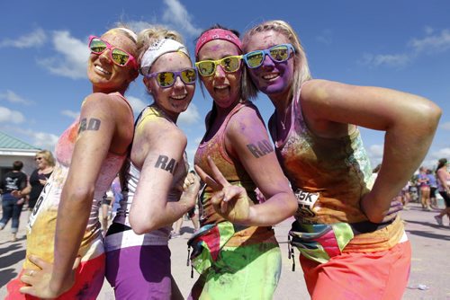 Kristin Hansford, 20, Jessica Bobick, 20, Nichole Kamann, 22, and Caty Hart, 21, some of about 13,000 people will participate in the 5km Color Me Rad run at the Red River Ex Grounds today and tomorrow, Saturday, July 20, 2013. (TREVOR HAGAN/WINNIPEG FREE PRESS)
