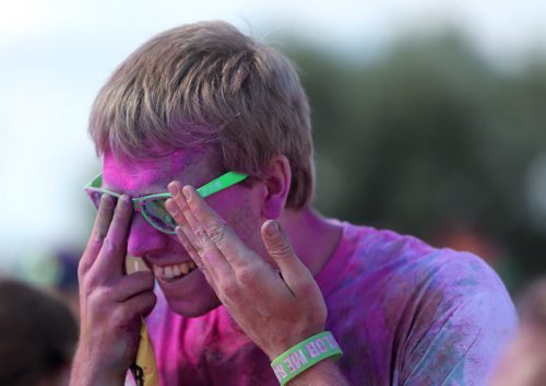 Travis Hrubeniuk, 22, was among 13,000 people expected to run the 5km Color Me Rad run at the Red River Ex grounds today and tomorrow, Saturday, July 20, 2013. (TREVOR HAGAN/WINNIPEG FREE PRESS)