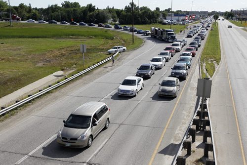 Gridlock that reportedly took as long as 90 minutes from Portage Avenue to reach the Ex Grounds. About 13,000 people are expected to run the 5km Color Me Rad run at the Red River Ex grounds today and tomorrow, Saturday, July 20, 2013. (TREVOR HAGAN/WINNIPEG FREE PRESS)