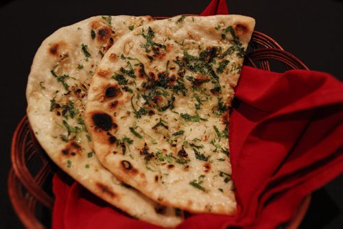 Dish: Garlic naan. Director Manjit Bedi and director/chef Jitender Kumar run The Great Maharaja East Indian Restaurant Ltd. at 510 Sargent Ave., which opened April 6, 2013. Saturday, July 20, 2013. (JESSICA BURTNICK/WINNIPEG FREE PRESS)