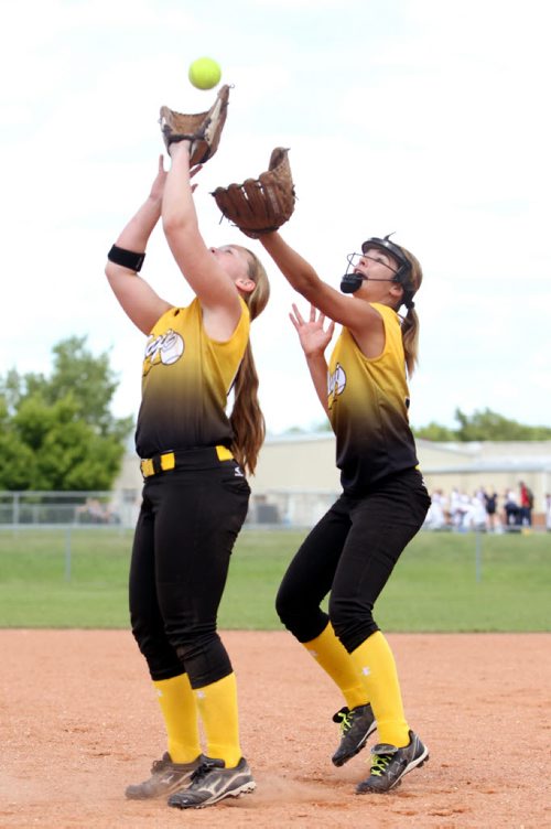 Brandon Sun 20072013 Darian Compton of the Westman Magic makes a catch with backup from Brooke Roeges during Softball Manitoba Under-14 girls provincial championship action against the Smitty's Terminators at the North End Community Centre ball diamonds on Saturday. (Tim Smith/Brandon Sun)