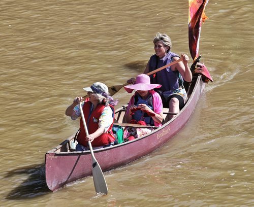 Margaret Brook (left), Lee Anne Penner who is knitting and Margerit Roger take part in the 2nd Annual Paddle to the Park to honour the memory of Don Starkell who was one of WinnipegÄôs greatest adventurers and storytellers.  130721 July 21, 2013 Mike Deal / Winnipeg Free Press