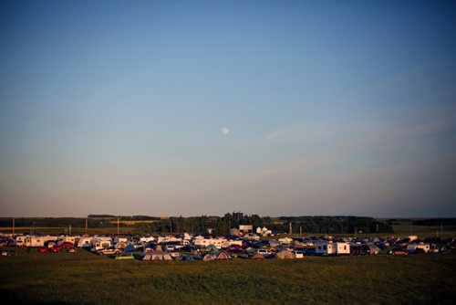 Brandon Sun 20072013 The moon rises over the Rolling River First Nation Pow Wow on Saturday evening. (Tim Smith/Brandon Sun)