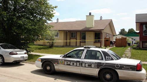 The home on Bondar Bay where Winnipeg Police Service say a 19 year-old male was found unresponsive after a fight at another home in the neighbourhood. The male victim was pronounced dead after being transported from the house.  130721 July 21, 2013 Mike Deal / Winnipeg Free Press