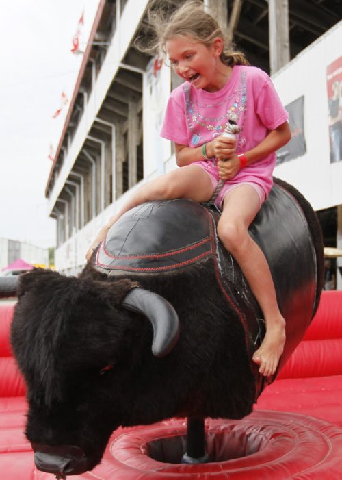 July 21, 2013 - 130721  - Kamryn Perry rides a mechanical bucking bull at the Morris Stampede Sunday, July 21, 2013. John Woods / Winnipeg Free Press