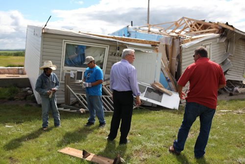 Brandon Sun 22072013 Manitoba Premier Greg Selinger tours the devastation caused by last weeks tornado at Sioux Valley Dakota Nation on Monday. (Tim Smith/Brandon Sun)