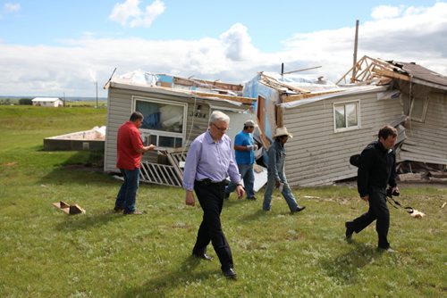 Brandon Sun 22072013 Manitoba Premier Greg Selinger tours the devastation caused by last weeks tornado at Sioux Valley Dakota Nation on Monday. (Tim Smith/Brandon Sun)