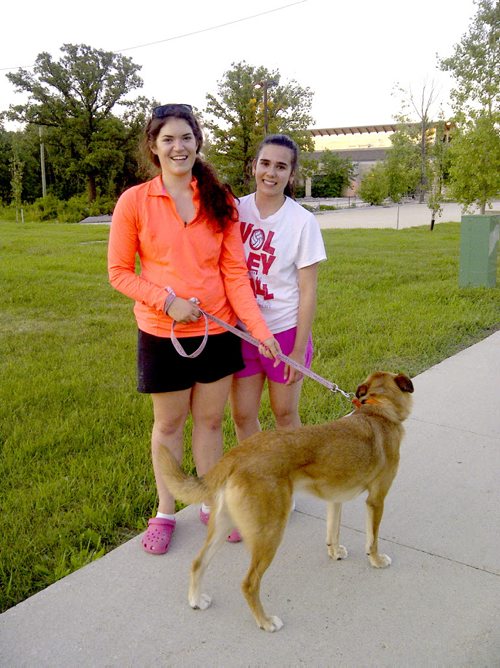 Captured rescue dog:  16-year-old Anne-Marie Gauthier and friend Sabrina Rossi in front of humane society moments after she collared Pauly. Gord Sinclair photo / Winnipeg Free Press.