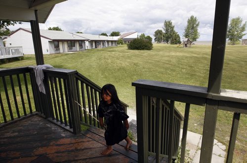 kids love to roam the spacious grounds at the lodge -  Damien  O'Meera  age 3 in poc walkig to his parents cottage -- Misty Lake Lodge is home to any aboriginal flood evacuee from the Lake Manitoba Flood , the  lodge  has not been paid for accommodating evacuees Äì Randy Turner story-  KEN GIGLIOTTI / JULY 22 2013 / WINNIPEG FREE PRESS