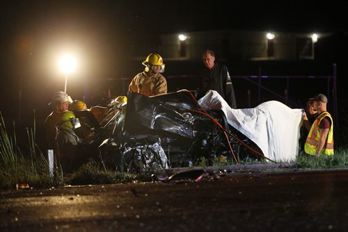 July 22, 2013 - 130722  -  Emergency personnel work to extricate a person from a vehicle that was involved in an MVC with a semi on the Trans Canada in Headingley Monday, July 22, 2013.  John Woods / Winnipeg Free Press. Derek Bossuyt