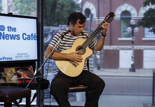 At 1 p.m. Colin Godbout, out of Vancouver BC, performed Canuck Quixote on his guitar live at the Winnipeg Free Press News Cafe. Tuesday, July 23, 2013. (JESSICA BURTNICK/WINNIPEG FREE PRESS)