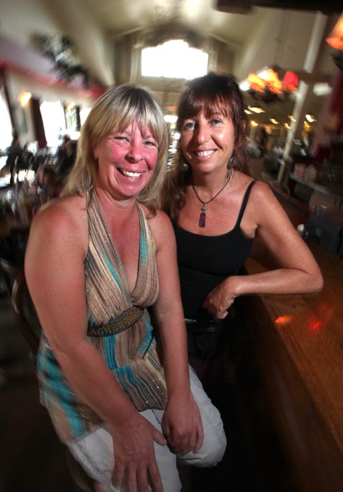 Heather Garden (left) poses with Bridgette Shaw at Brandon's Lady of the Lake's Restraunt, where she manages the business owned by Bridgette. Once condemmed to a wheelchair, Heather abandoned traditional medical treatments and now has a healthy active lifestyle. See Bill Redekop's story. July 23, 2013 - (Phil Hossack / Winnipeg Free Press)