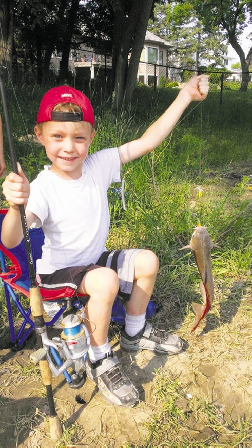 Canstar Community News July 24 -- 5 year old Declan Pfeifer pulled his first catfish out of the Assiniboine at Westwood Green this July. No license required for kids under 16; Bug spray recommended!  SHARON PFEIFER/FOR CANSTAR NEWS METRO