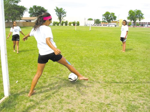 Canstar Community News From left: Mya Lee, Cassie Nazeravich and Nicole Davis enjoy a quick soccer practice in Southdale days before leaving for Calgary to represent Manitoba in an U-13 invitiational tournament this week. (SIMON FULLER)