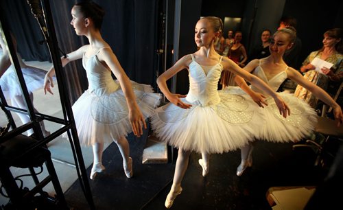 Aspiring ballerina's with the RWB School strike a pose assuming the stage at The Lyric Theater in Assinaboine Park Wednesday evening for Ballet in the Park. See release....the annual perfomances wrap up July 26. July 24, 2013 - (Phil Hossack / Winnipeg Free Press)