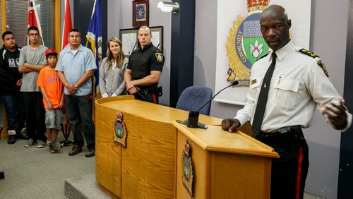 Winnipeg Police Chief Devon Clunis speaks to media at the announcement of the Winnipeg Police partnership with the 4Life Foundation and the donation of twenty Blue Bombers tickets for children involved in the foundation. Kids from the Pine Creek Reserve who take part in the program were on hand for the announcement. 130725 - Thursday, July 25, 2013 - (Melissa Tait / Winnipeg Free Press)