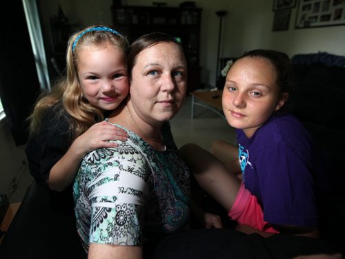 Sabrina Gamey poses with her daughters Taylor (7) and Amethyst "Ammy". The 2 girls are going to camp curtosy of the Sunshine Fund. See story. July 26, 2013 - (Phil Hossack / Winnipeg Free Press)