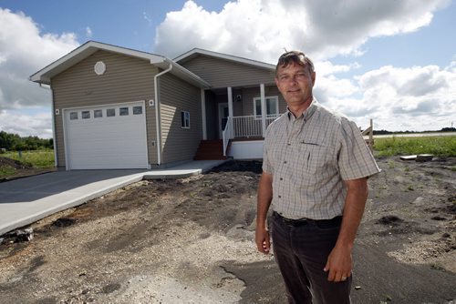 Business -Sanford Meadowbrook Villas show home , in pic real estate agen Blair Sonnichen  , with modular homes  for the 50 Plus development in  Sanford .  murray mcneill story  KEN GIGLIOTTI / JULY 26 2013 / WINNIPEG FREE PRESS