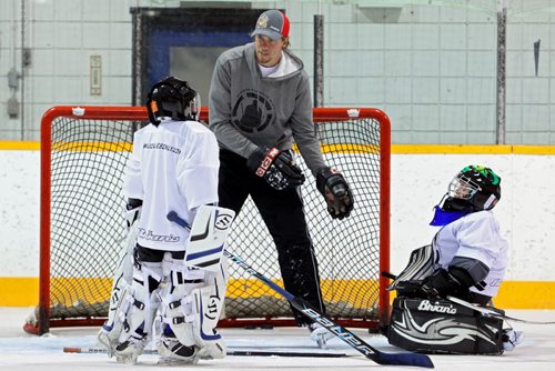 Brandon Sun 26072013 NHL goaltender Jacob Markstom gives pointers to young goalies taking part in the annual Plante's Crease Management goaltender's school at the Sportsplex on Friday.  (Tim Smith/Brandon Sun)