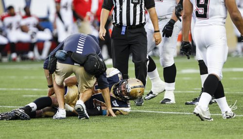 Ryan Lucas (#94) sustained an injury during gameplay. The Winnipeg Blue Bombers faced off against the Calgary Stampeders at home on Friday, July 26, 2013. (JESSICA BURTNICK/WINNIPEG FREE PRESS)