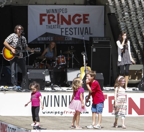 The Rachel Ashley band performs at the Cube while children dance and play in the Old Market Square on Saturday afternoon, which marks the second last day of the Winnipeg Fringe Festival. Saturday, July 27, 2013.  (JESSICA BURTNICK/WINNIPEG FREE PRESS)