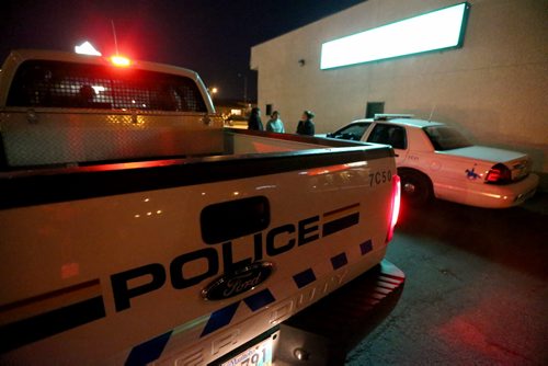 RCMP arrest an underage male, outside the Burntwood Hotel in Thompson, early, Tuesday, July 23, 2013. (TREVOR HAGAN/WINNIPEG FREE PRESS)