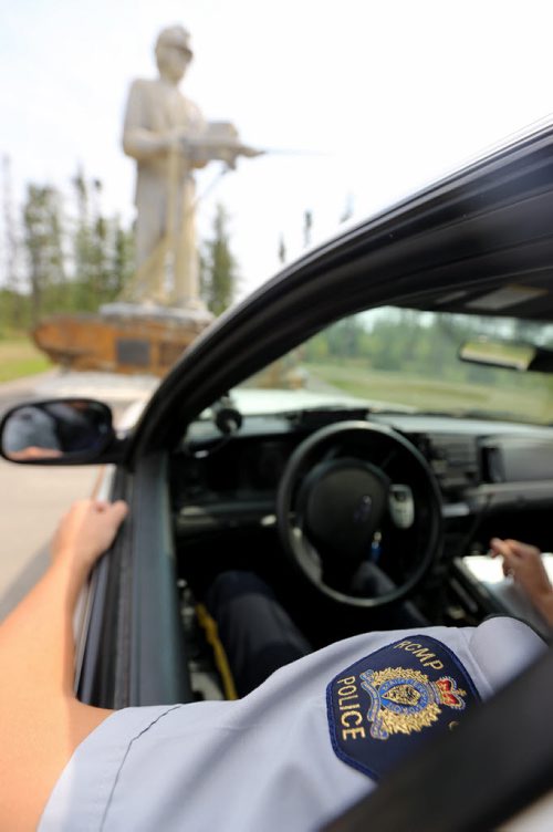 In front of the King Miner Statue during a ride along with RCMP Special Const. Kyle Boisvert, in Thompson, Tuesday, July 23, 2013. (TREVOR HAGAN/WINNIPEG FREE PRESS)