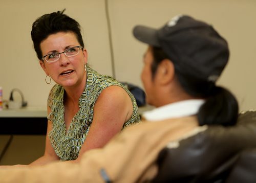 Paullette Simkins, Executive Director of the Thompson Homeless Shelter, speaking with a shelter client, John George, Monday, July 22, 2013. (TREVOR HAGAN/WINNIPEG FREE PRESS)