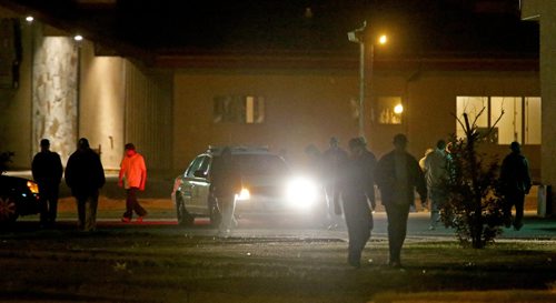 Bar patrons outside the Burntwood Hotel in Thompson leave after an RCMP car pulls in, Tuesday, July 23, 2013. (TREVOR HAGAN/WINNIPEG FREE PRESS)