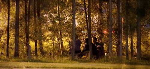 Three people sitting at a drinking spot in the bushes near the Burntwood Hotel in Thompson, late, Monday, July 22, 2013. (TREVOR HAGAN/WINNIPEG FREE PRESS)