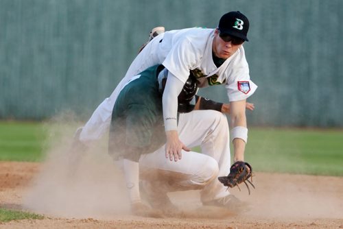Brandon Sun 28072013 Garrett Popplestone #10 of the Brandon Cloverleafs is taken out by Ryan Cooper #4 of the Neepawa Farmers as Cooper slides into second base during MSBL semifinal playoff action at Andrews Field on Sunday evening. (Tim Smith/Brandon Sun)