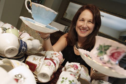 July 29, 2013 - 130729  -  In her Winnipeg home Monday, July 29, 2013 Sandra Lorange, a Guardian Angels committee member, is photographed with some of the tea cups that have been donated for for an upcoming CancerCare Manitoba Foundation fundraiser. John Woods / Winnipeg Free Press