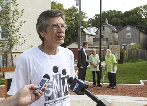 Families and residents of two inner-city neighbourhoods now have access to two newly redeveloped parks in Winnipeg; Chief Grizzly Bear's Garden (formerly known as Spence Aboriginal Spirit Park) on Sherbrooke St. at Sargent, and Jacob Penner Park on Victor Ave. at Notre Dame. The announcement was made from the Sherbrooke location by Gerry Berard (pictured), vice president of the Spence Neighbourhood Association, Justice Minister Andrew Swan and Mayor Sam Katz. Joint funding in the amount of $475,000 was provided by the province and the city through the Building Communities Initiative. Tuesday, July 30, 2013. (JESSICA BURTNICK/WINNIPEG FREE PRESS)