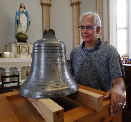 ST.B Museum director Philippe Mailhot  with The Bell of Batoche is now on display at the St. Boniface Museum (web today) Tuesday and Wed . And then be moved for maintenance  and it will return to it's new home at the St.Boniface Museum on Tache Ave  next Tuesday  Äì the 20 lbs silver bell was taken from the Metis community in Batoche Sask in 1885  after the North-West Rebellion   KEN GIGLIOTTI / JULY 30 2013 / WINNIPEG FREE PRESS