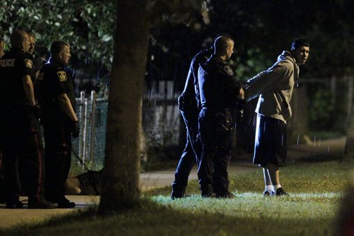 July 31, 2013 - 130730  -  Winnipeg police detain residents of 891 Aberdeen early Wednesday morning, July 31, 2013. John Woods / Winnipeg Free Press