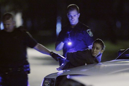 July 31, 2013 - 130730  -  Winnipeg police detain residents of 891 Aberdeen early Wednesday morning, July 31, 2013. John Woods / Winnipeg Free Press