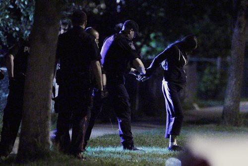 July 31, 2013 - 130730  -  Winnipeg police detain residents of 891 Aberdeen early Wednesday morning, July 31, 2013. John Woods / Winnipeg Free Press