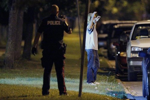 July 31, 2013 - 130730  -  Winnipeg police detain residents of 891 Aberdeen early Wednesday morning, July 31, 2013. John Woods / Winnipeg Free Press