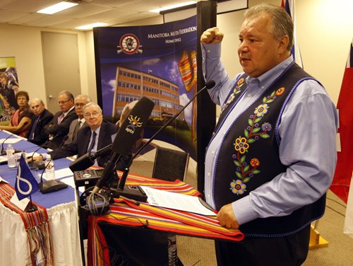 Land Claims Strategic Investment Committee Äì RtoL - David Chartrand Pres. renacts fist pump as he reacted when the court decsion was in favour of the Metis regarding land claims - with former PM , Paul Martin ,Hartley Richardson , Sanford  Riley , Harvey Secter , as well as Minister Denise Thomas - (not present is  Dr. Eric   Newell )Äì at MMF newser all joining to advise  David Chartrand Pres. of MMF with negotiation issues . KEN GIGLIOTTI / JULY 31 2013 / WINNIPEG FREE PRESS
