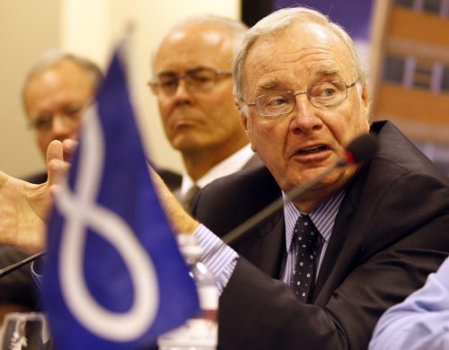 Land Claims Strategic Investment Committee Äì RtoL - former PM , Paul Martin  with Metis flag in foreground ,Hartley Richardson , Sanford  Riley , Äì at MMF newser all joining to advise  David Chartrand Pres. of MMF with negotiation issues . KEN GIGLIOTTI / JULY 31 2013 / WINNIPEG FREE PRESS