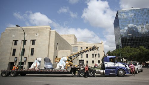 CancerCare bears on the move. Both polar bear sculptures located at York and Vaughn St., as well as several located behind the Manitoba Legislature along Assiniboine Dr., were removed today and transported to a new home.  Wednesday, July 31, 2013. (JESSICA BURTNICK/WINNIPEG FREE PRESS)