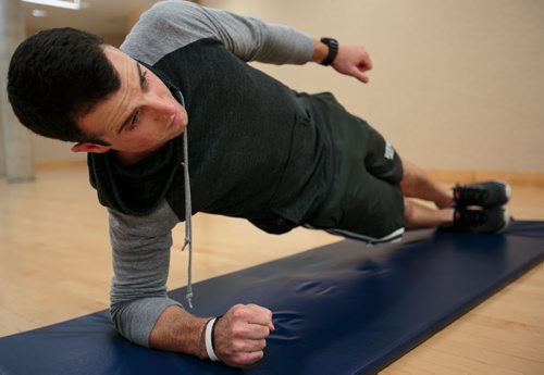 Tim Shantz demonstrates a side plank, using his core muscles to keep the body rigid.  (For Shantz fitness column) 130731 - Wednesday, July 31, 2013 - (Melissa Tait / Winnipeg Free Press)